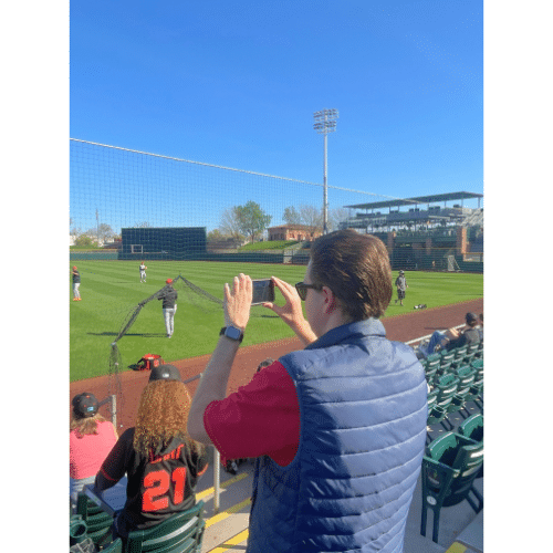 Baseball fane taking pictures at Scottsdale Stadium