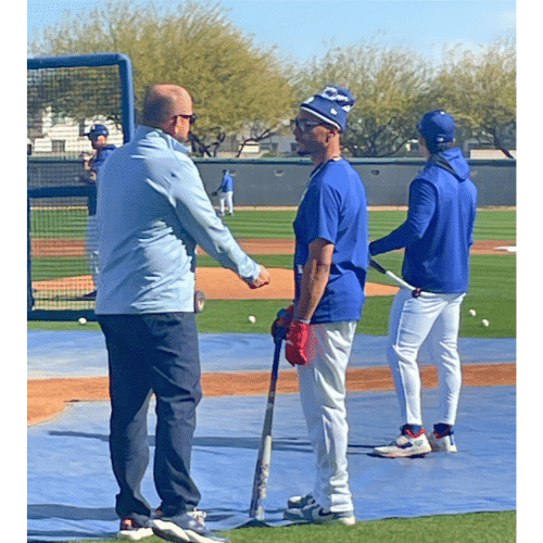 Mookie Betts talking to someone near the batting cage at Camelback Ranch