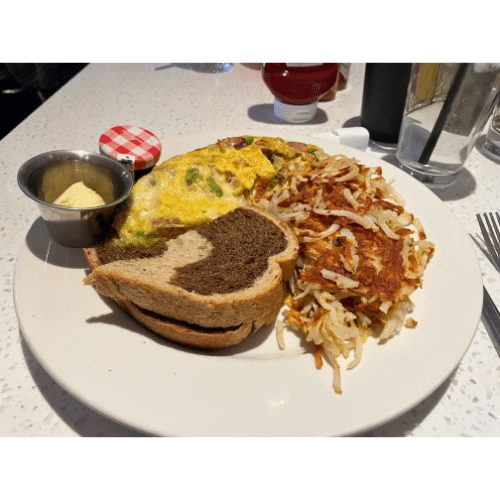 Breakfast plate. Omelet with toast and hash browns